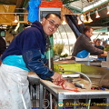 A friendly fishmonger at work